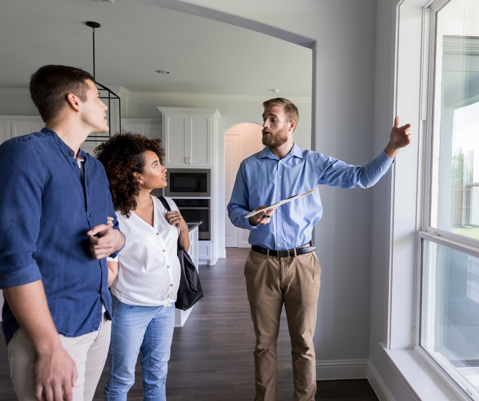 An agent talks a couple through the features of a home