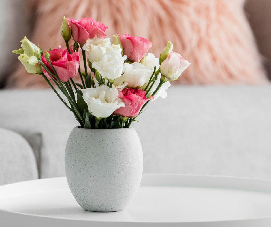 Spring flowers in a vase in a home which is staged to sell