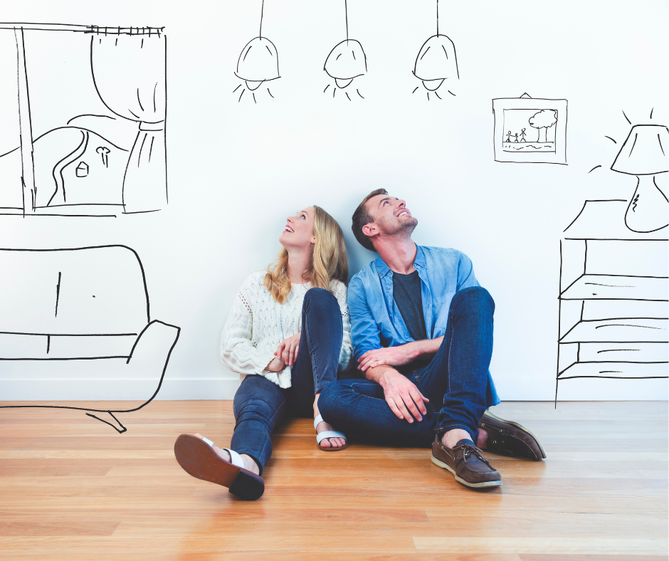 Young couple who are first-time buyers sit on the floor of their new home in South-west Sydney