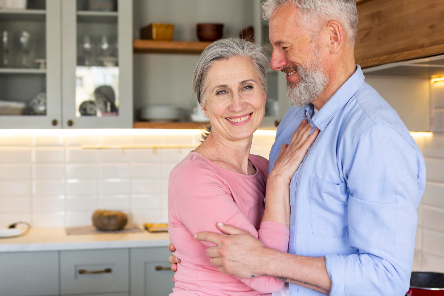 Happy couple smiling after selling their house for more than market value